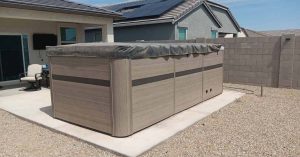 Properly covered swim spa in backyard setting