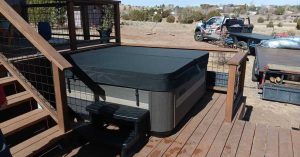 Snapcap hot tub cover installed on a backyard spa for durability and protection ft