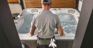Technician servicing a hot tub outdoors in Las Vegas ft