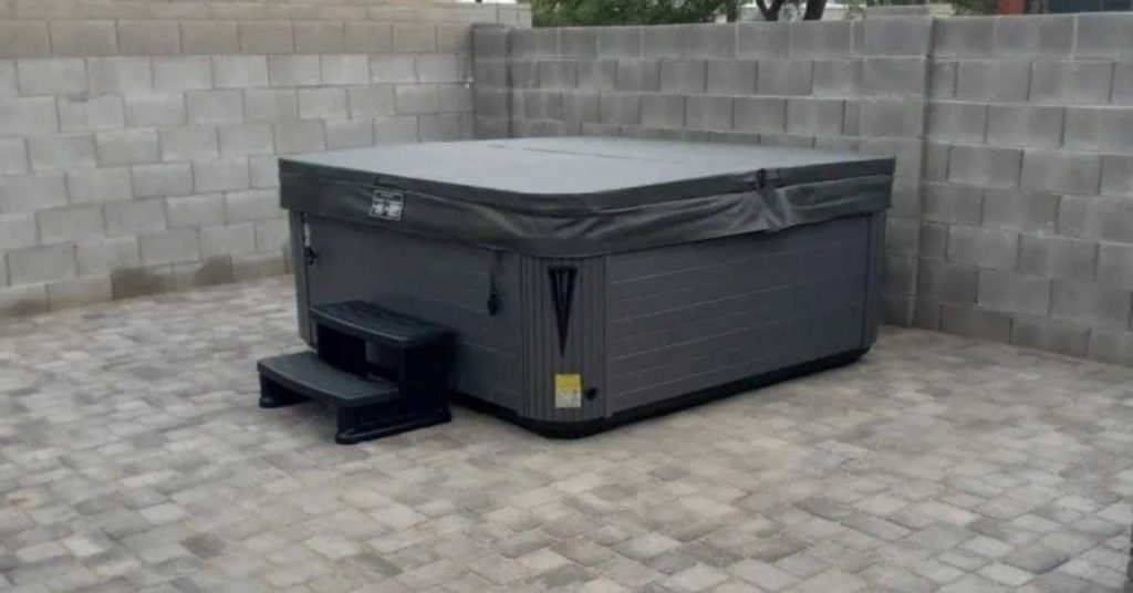 Premium hot tub with insulated cover in Las Vegas backyard under desert sun