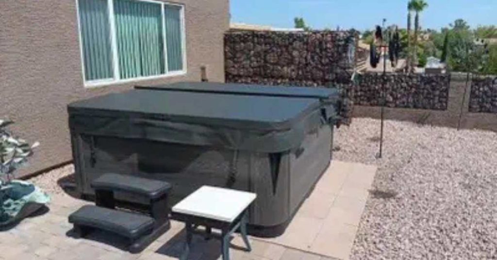 Premium insulated hot tub cover in a Goodyear Arizona backyard under bright desert sun