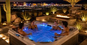 Luxury hot tub in a Las Vegas backyard with ambient lighting and desert-inspired landscaping