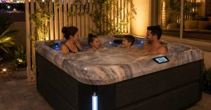 A family soaking on a modern energy-efficient hot tub installed in a Las Vegas. Use this attached image for inspiration.