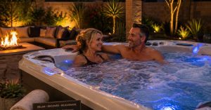 Couple relaxing in a premium hot tub in a Chandler Arizona backyard enjoying the health benefits of hydrotherapy