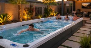 Family enjoying a modern swim spa in a Chandler backyard for exercise, relaxation, and hydrotherapy