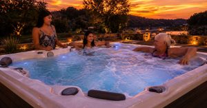 a Premium hot tub at sunset with bubbling hydrotherapy jets, comfortable seating, ambient lighting