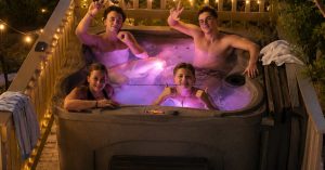 Mesa homeowners relaxing in a premium outdoor hot tub