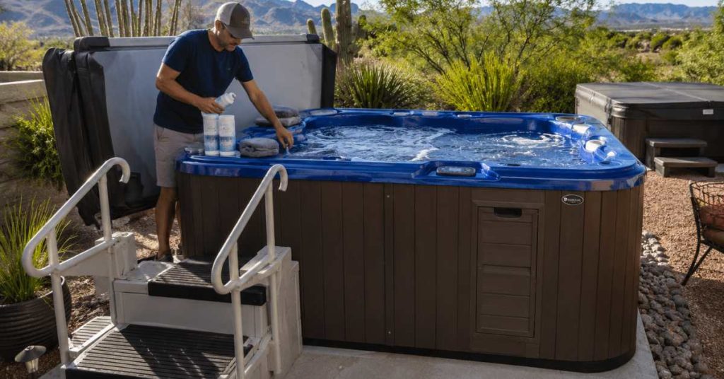 Tucson homeowner preparing a premium backyard hot tub for summer