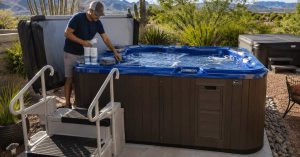 Tucson homeowner preparing a premium backyard hot tub for summer